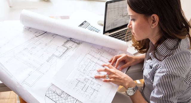 architect_reviewing_designs