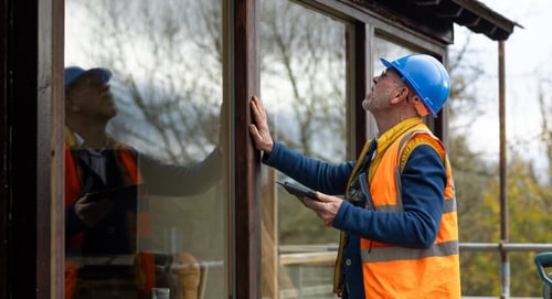 developer_inspecting_window_in_new_home